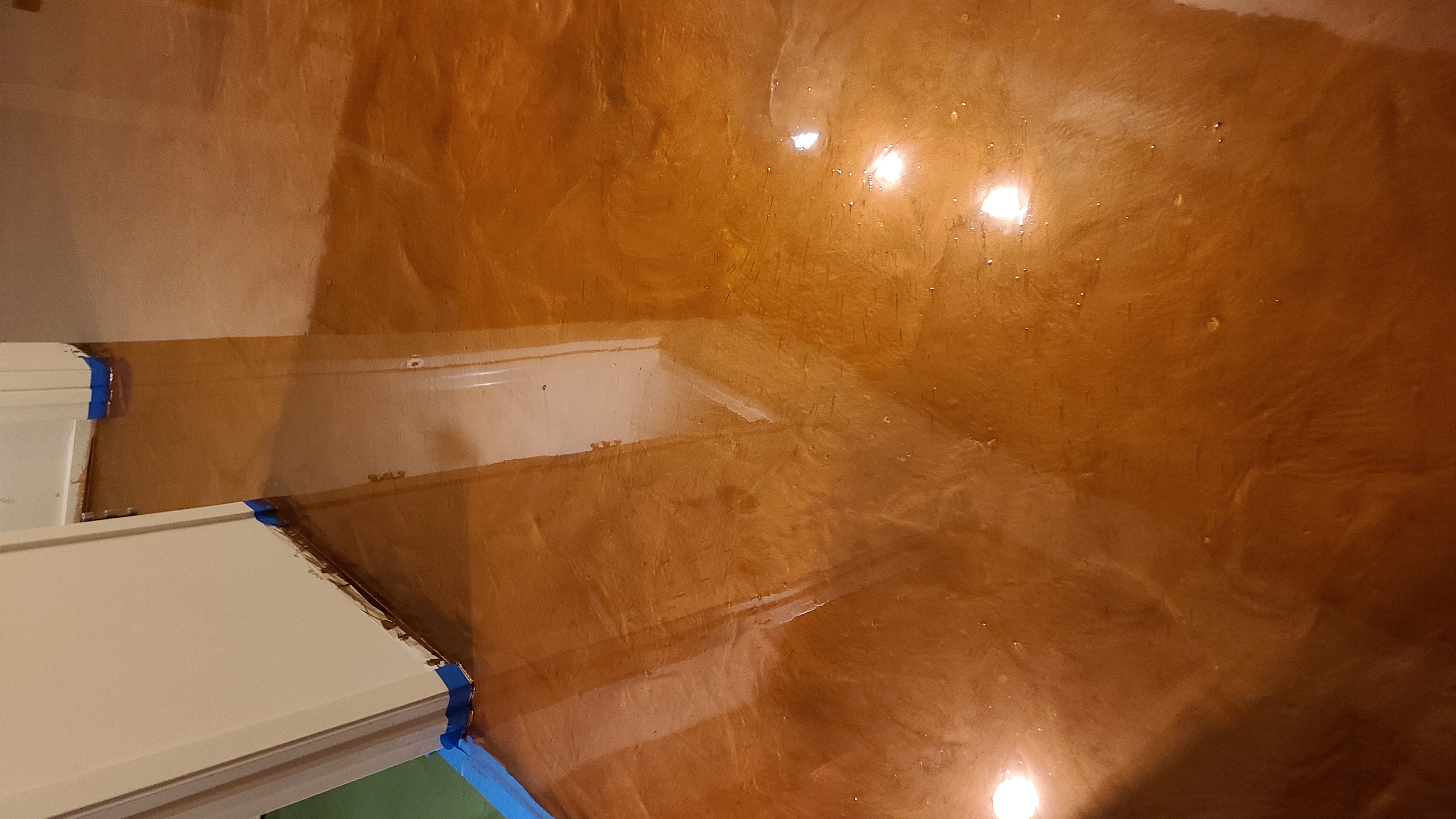 Metallic epoxy flooring in University Park residence